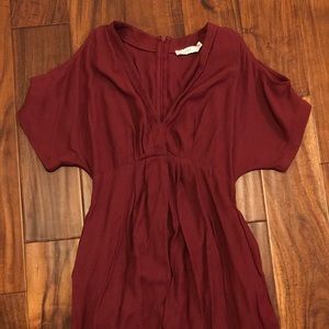 Adorable dress! Cut out shoulders and has pockets!